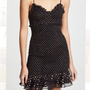 Likely black and gold dress